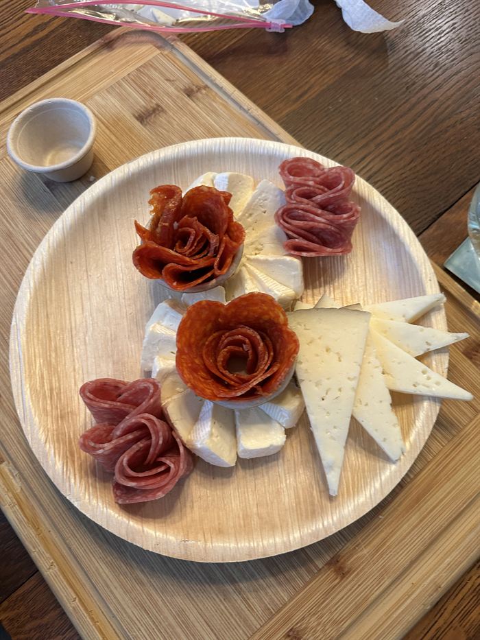 Finished individual charcuterie board with salami roses and cheese